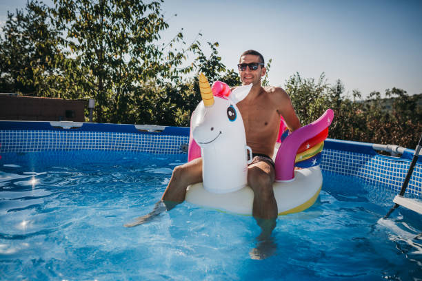 istock Handsome man in the pool 1272891269