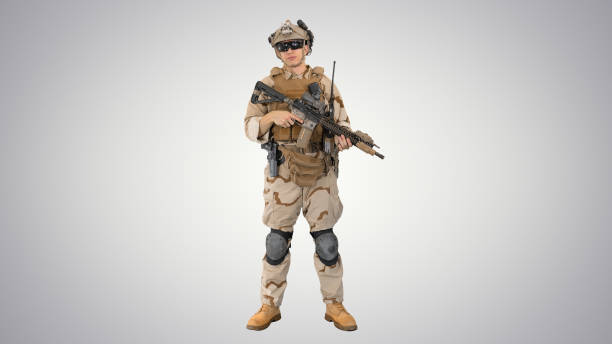 istock Happy young soldier talking and smiling on gradient background 1272893667