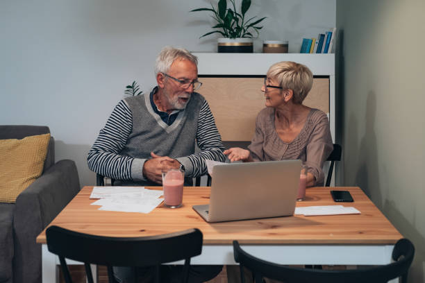 istock Couple arguing over bills stock photo 1272897018