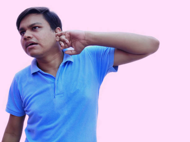 istock Man put hand over ear to listen carefully 1272900090