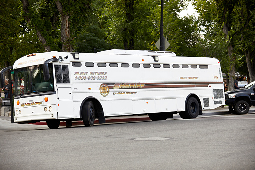 Prescott, Arizona, USA; - September 11, 2020:  Yavapai County Sheriff's department inmate transport bus parked in downtown Prescott in preparation for a possible riot.