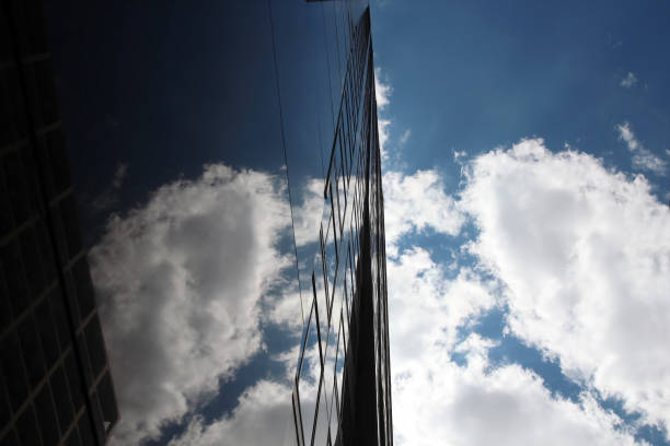 istock the skyscraper in a modern city with a blue sky. Reflection 1272907427