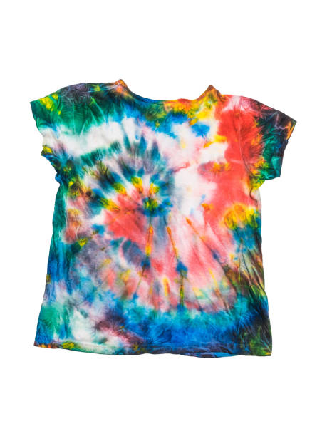 istock T-shirt with a homemade tie dye pattern isolated on a white background. 1272908261
