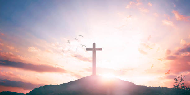 istock Religious concept: Silhouette cross and birds flying on  sunrise background 1272909784
