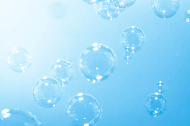 istock Blue soap bubbles float in the air. Freshness summer natural background. 1272911588