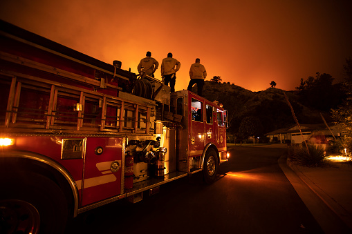 Monrovia, California / USA - September 15, 2020: Firefighters work the Bobcat Wildfire in the hills above Los Angeles.