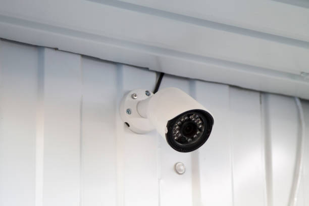 istock white CCTV surveillance camera mounted on wall of building 1272914494