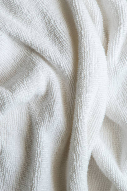istock Close up. White cotton wrinkle fabric texture. 1272916268