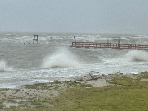 A wave crashing ashore in Texas during a storm