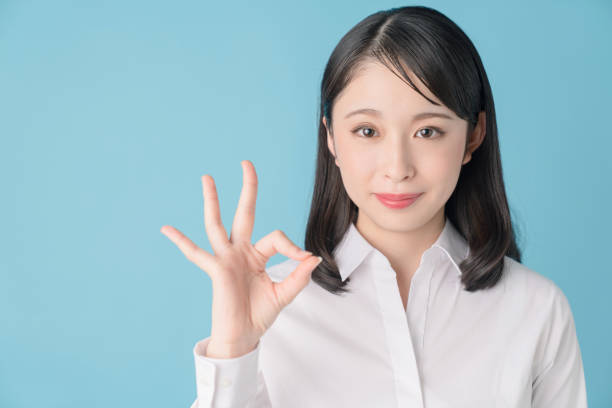 istock Young woman showing OK hand sign. 1272920164