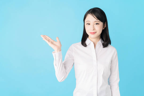 istock Young asian girl pointing at blank space. 1272920172