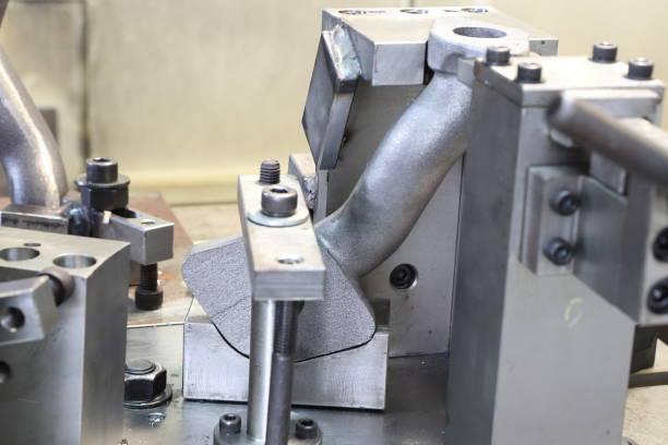 istock iron casting pipes were clamped on jig 1272923681