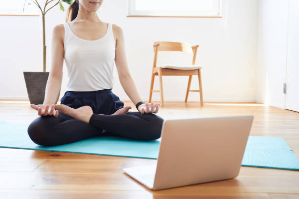 istock Young woman exercising in the room 1272928095