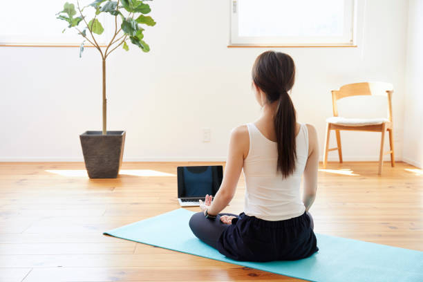 istock Young woman exercising in the room 1272928108