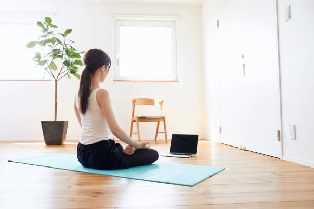 istock Young woman exercising in the room 1272928113