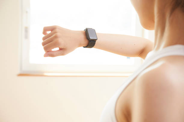 istock Young woman measuring with a smartwatch 1272928144