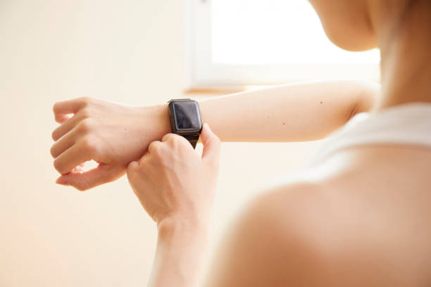 istock Young woman measuring with a smartwatch 1272928149