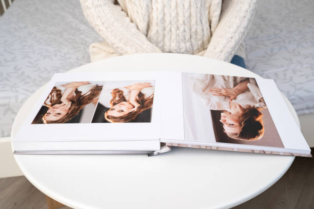 istock wedding photo book with thick pages on white table. 1272928360