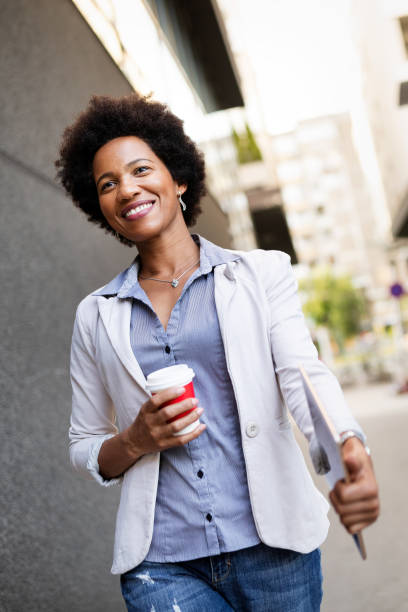istock Business woman using tablet on coffee break in city 1272931142
