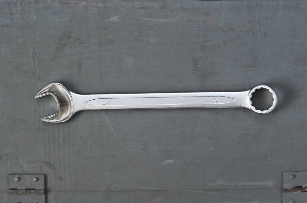 istock wrench on a gray painted wood surface. metal tools for manual work 1272933256