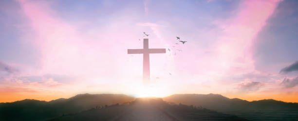 istock Religious concept: Silhouette cross and birds flying on  sunrise background 1272936145