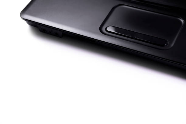 istock Laptop black color on white floor and copy space 1272937146