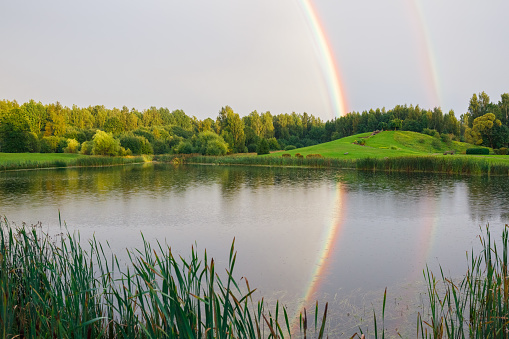 City Talsi, Latvia. Rainbow over the lake. Travel photo.05.09.2020