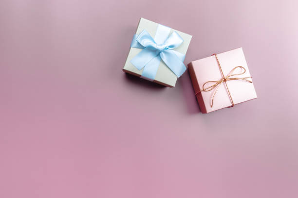 istock Two gift box on pink background for special day 1272940393