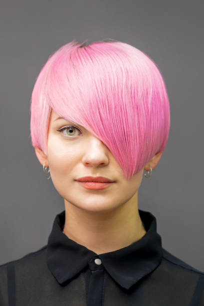 istock Woman with short bright pink hair 1272940548