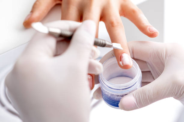 istock Process of applying acrylic powder on the nails 1272940762