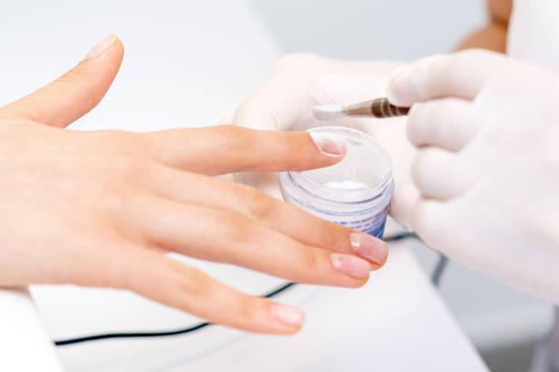 istock Process of applying acrylic powder on the nails 1272940786
