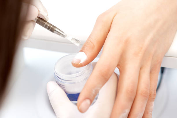 istock Process of applying acrylic powder on the nails 1272940807