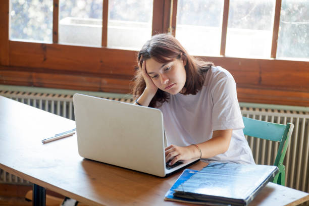 istock Girl studying with laptop 1272941693