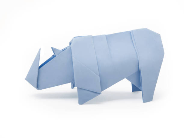 istock Origami cute rhinoceros on a white background 1272943518
