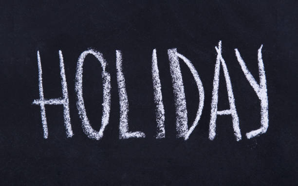 istock Blackboard with Holiday inscription on blackboard background 1272944024
