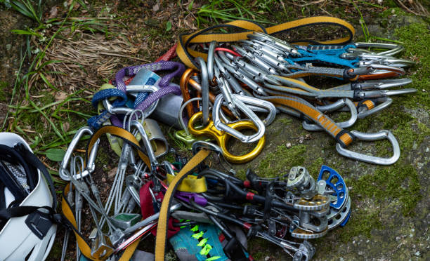 a set of quick draw carabiners and other protection equipment used for rock climbing