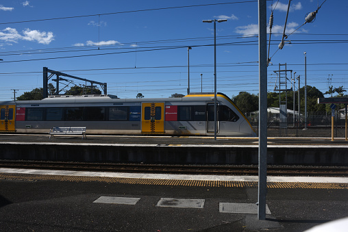 Queensland rail commuter electric train waiting for passengers at Caboolture station.