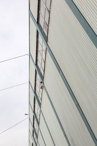 istock Industrial building against gray sky 1272950441