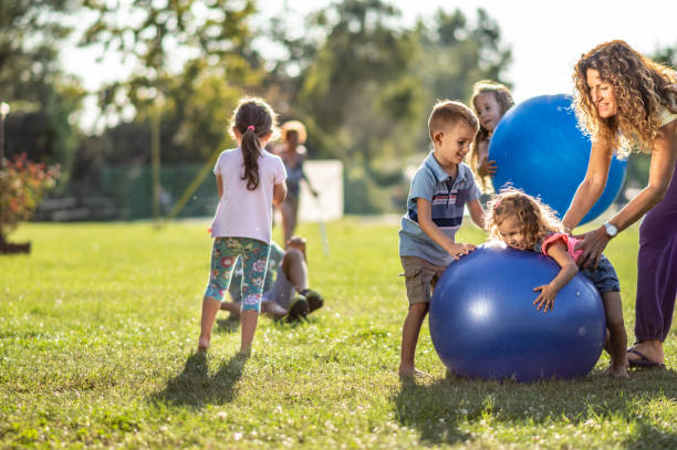istock Group of kids playing in nature 1272950542