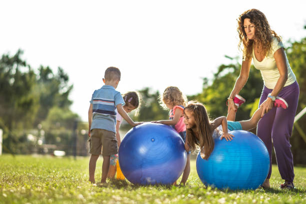 istock Group of kids playing in nature 1272950680