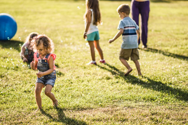 istock Group of kids playing in nature 1272950856