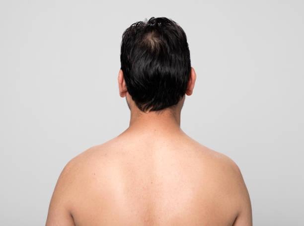 istock Rear view of mid adult man 1272951071