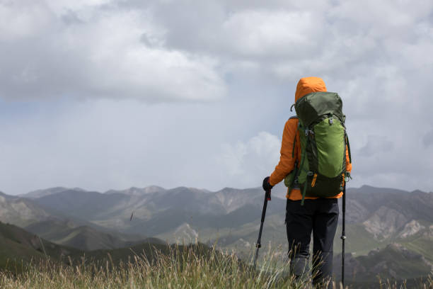 istock Backpacker hiking on high altitude mountain top 1272951197
