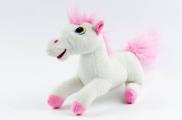 istock White horse with a pink mane on a white background 1272951829