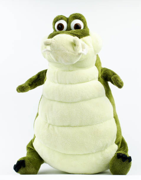 istock Green plush crocodile on a white background 1272952044