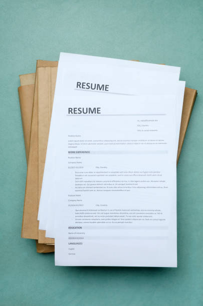 Vertical Imagetop View Of Stack Of Resume Forms And Folders On The Office  Blue Desk Stock Photo - Download Image Now - iStock