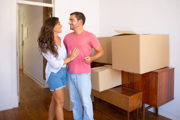 istock Happy young couple moving into new flat 1272953893