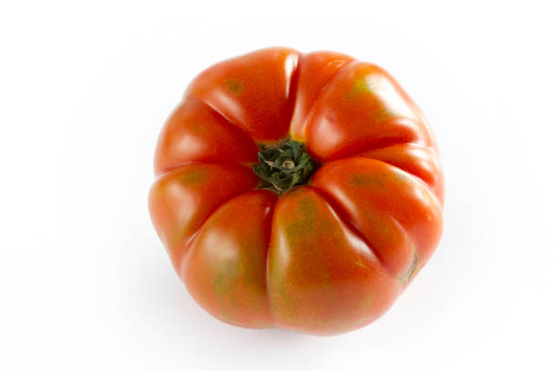 istock organic and red tomato background 1272953978