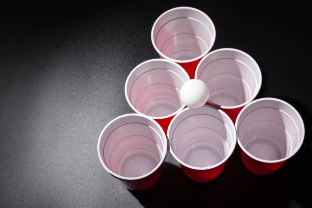 istock Beer pong college game on black background 1272956781