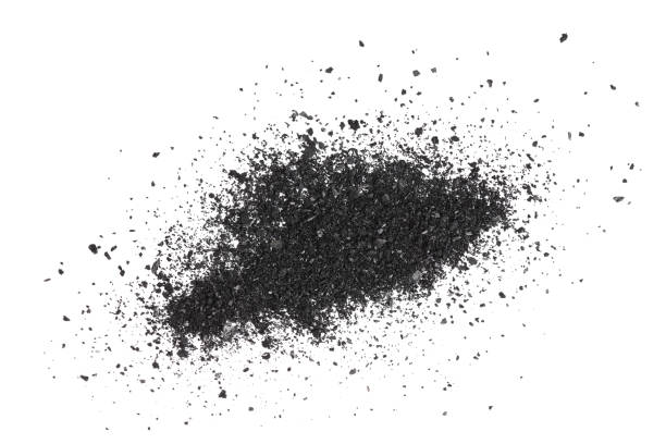 istock Pile of coal carbon or charcoal dust isolated on white background 1272956926